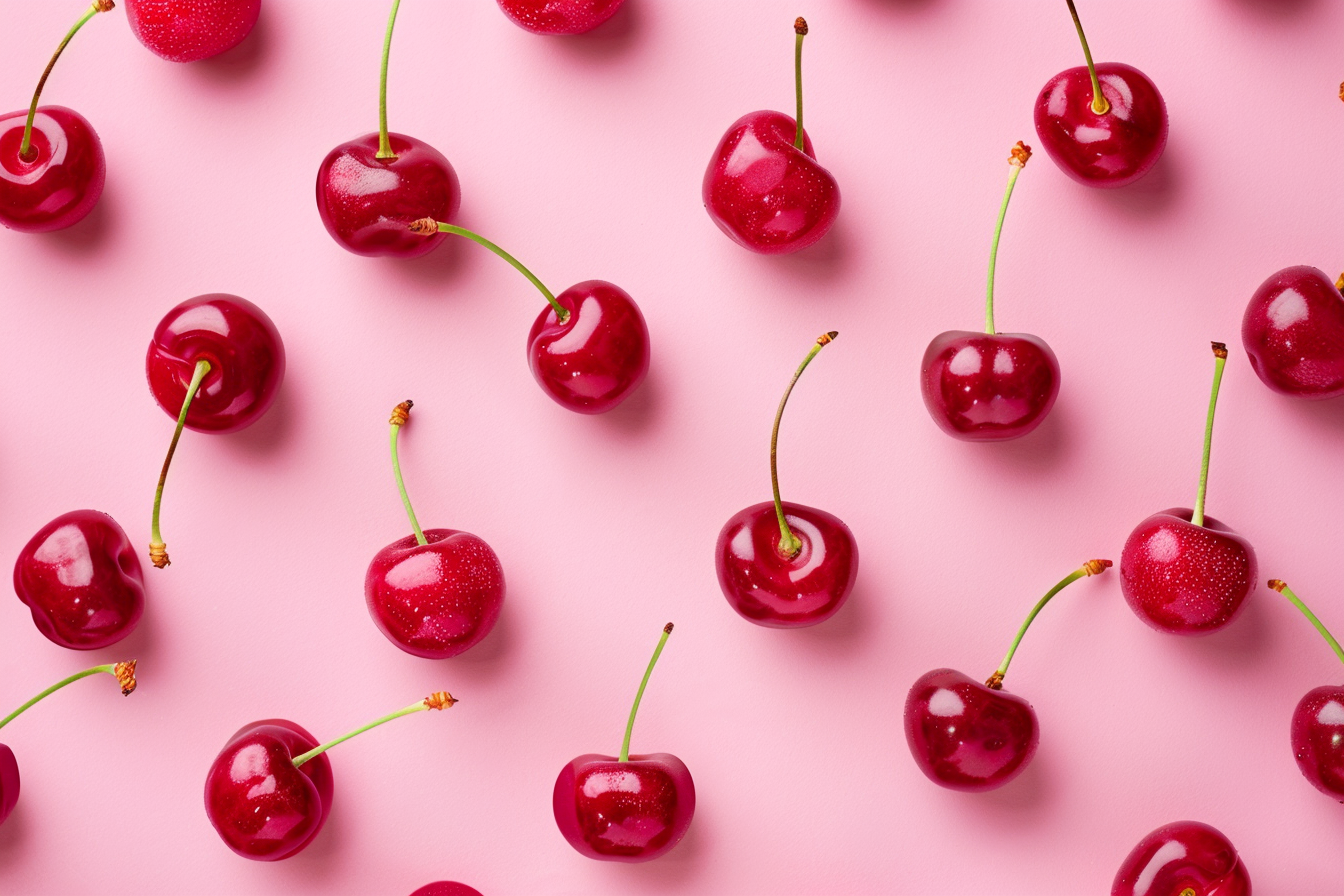 Image gratuite Tranches de cerises sur fond rose pastel 3